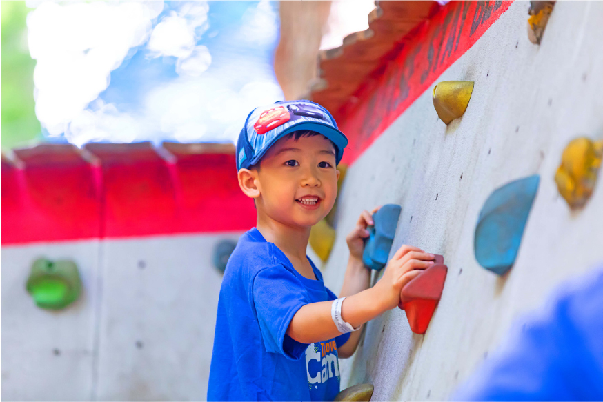 Child climbing wall